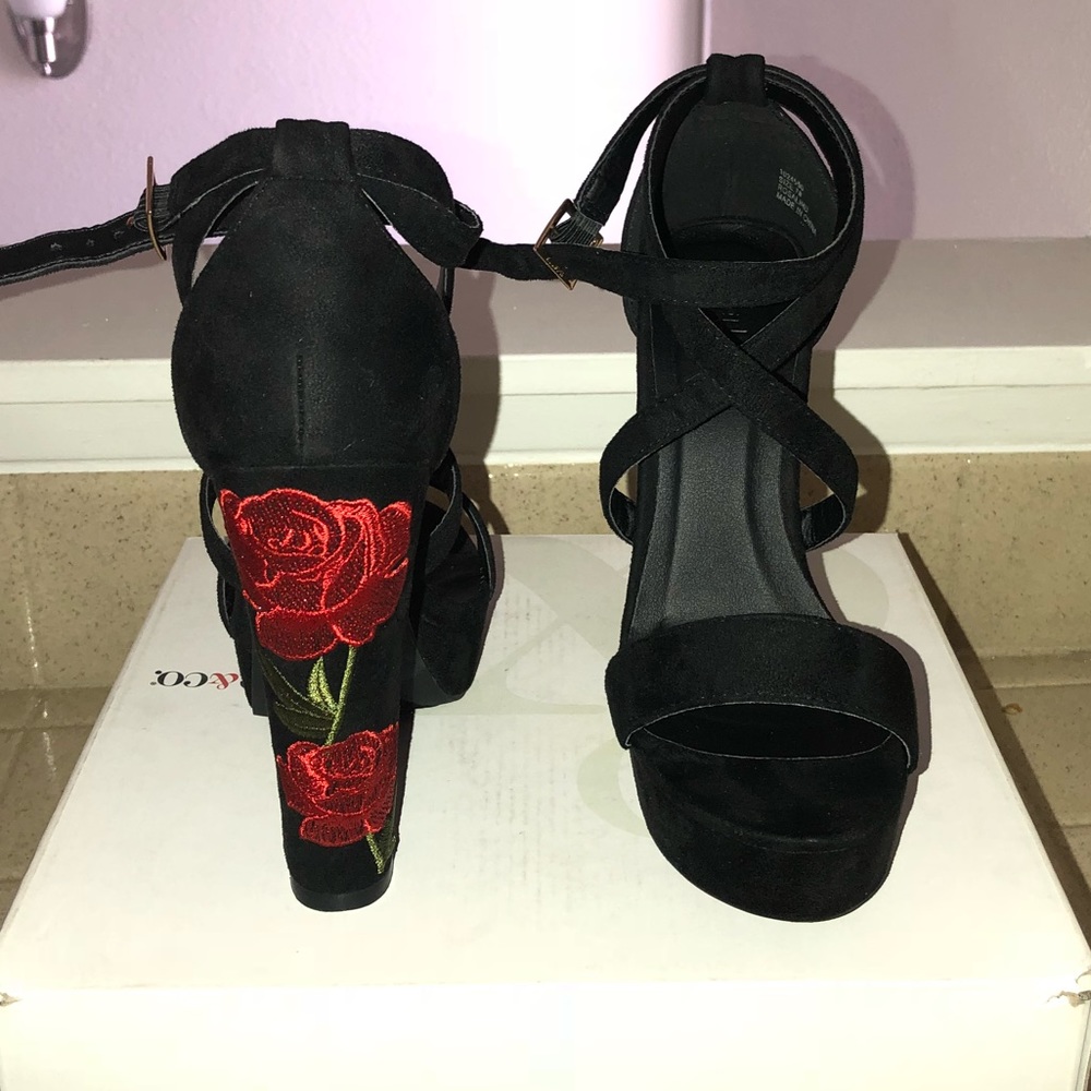 Rose embroidered platform  heels.